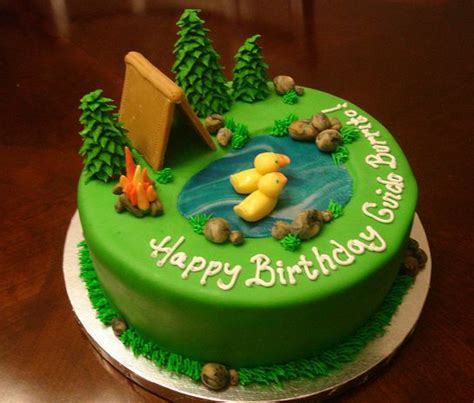 Maybe you would like to learn more about one of these? Green round camping theme cake with pond and ducks and ...