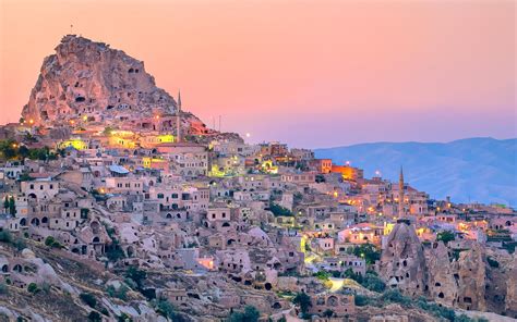 Uchisar Cave City In Cappadocia Turkey On Sunset Fotocorsi
