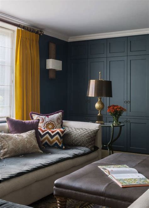 Do you find mustard walls living room. Dark blue panelling contrasts with mustard yellow curtains ...