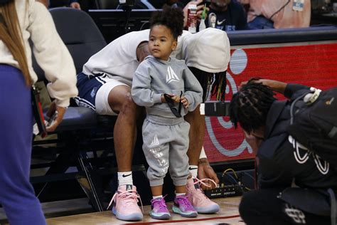 Memphis Grizzlies Guard Ja Morant 12 Ties His Shoes With His Daughter