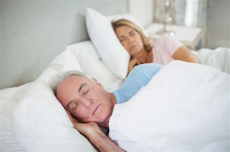 Premium Photo Senior Couple Sleeping On Bed