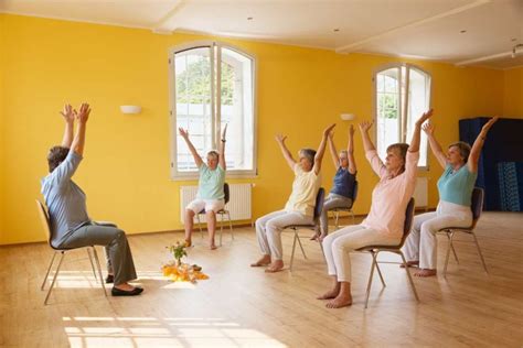 Senior Citizens Doing Yoga On Chair Image Canva