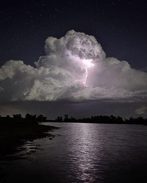 A Cloud Illuminated By Lightning While On A Diving Trip In The Grand