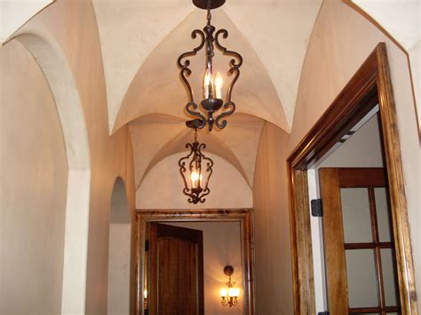 The Light Fixture Is Hanging From The Ceiling In The Hallway Between