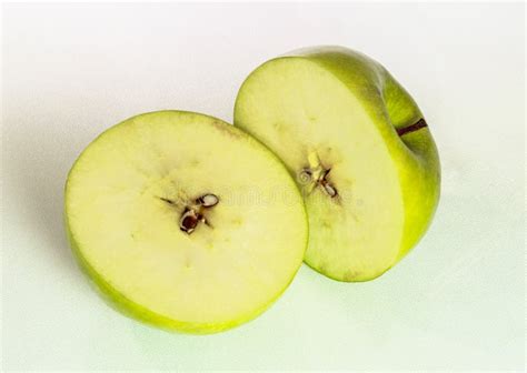 Close Up Of A Natural Half Sliced Green Apple Stock Photo Image Of