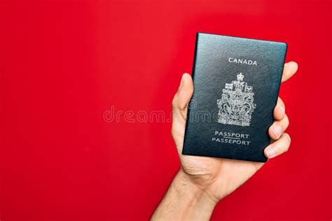 Beautiful Hand Of Man Holding Canada Canadian Passport Identification