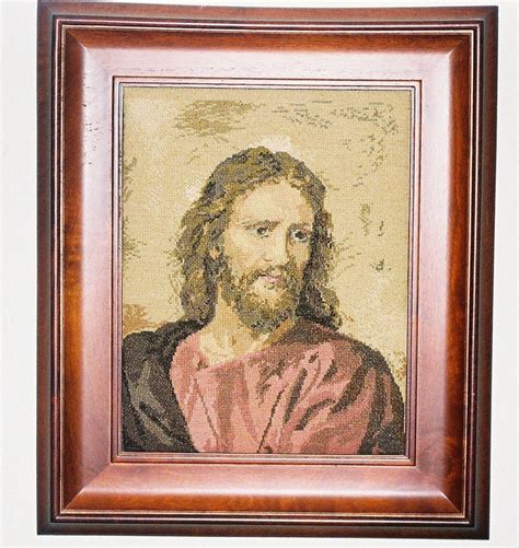 A Painting Of Jesus Is Hanging On The Wall