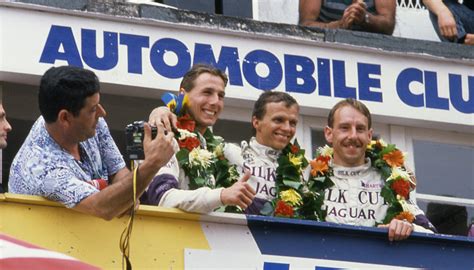 Johnny dumfries (second left) celebrates winning le mans 24 hours in 1988. Le Mans 24hr Podium 1988, Johnny Dumfries, Jan Lammers, An… | Flickr