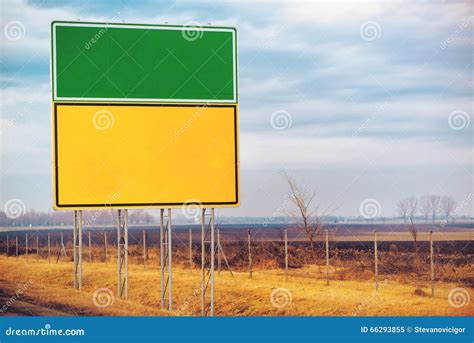 Blank Traffic Sign With Arrows Pointing In Opposite Directions Stock