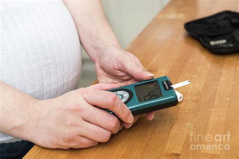 Pregnant Woman Testing Blood Sugar Level In Diabetes Photograph By