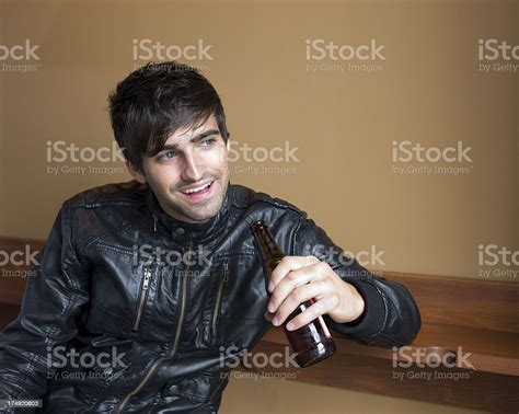 Young Man Drinking Beer In A Bar Stock Photo Download Image Now Istock