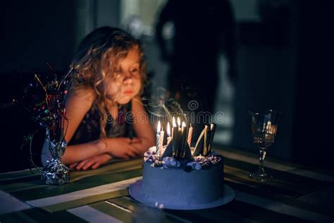 Cute Funny Blonde Girl Blowing Candles On Her Birthday Cake In Dark Room Happy Birthday Party