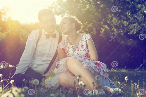 Romantic Couple In Love Flirting On Grass In Sunny Park Vintage Stock