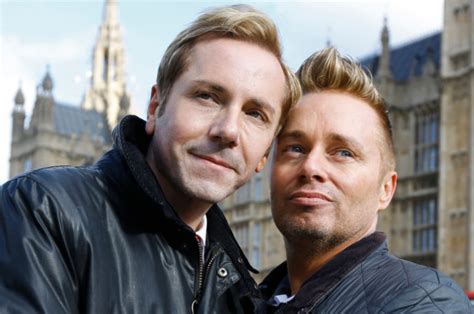 The couple managed to climb on to the roof and were rescued by fire crews. Daughter of Britain's 'first gay dads' is happy father is ...
