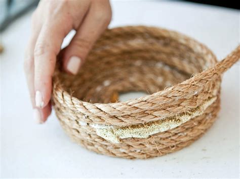 Learn how to make your own rope basket to spruce up your storage. How to Make a Metallic Rope Basket | HGTV