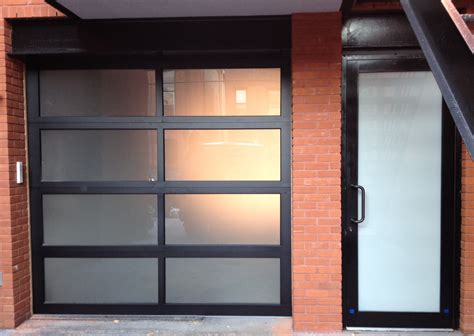 Modern oversized steel garage doors black glass. Aluminum Glass Garage Doors Are A Modern Trend