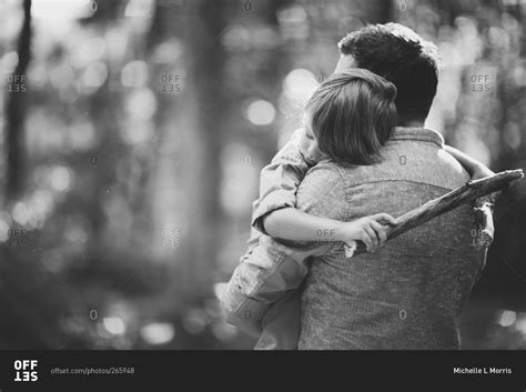 A Father Gives His Son A Hug Stock Photo Offset