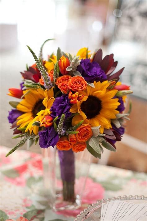 Maybe you would like to learn more about one of these? Sunflowers in a wedding bouquet with purple and orange ...