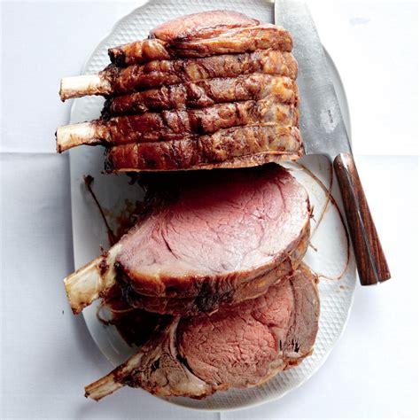The beef is cooked to 120 degrees fahrenheit, medium rare, and finishes cooking as it rests outside of the oven. Stand Rib Roast Christmas Menu - Standing Rib Roast Of ...