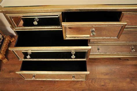 Typically placed along walls in dining rooms, they can be used to set food for serving buffet style, and for storing linens, china and other serving supplies. Mirrored Chest Sideboard Buffet Server Art Deco Drawers