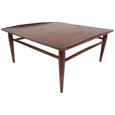 It's made from a blend of solid and manufactured wood and sturdy lift top table easier to lift up and close, with larger hidden compartment and adjustable storage shelf. Mid-Century Modern Square Walnut Coffee Table by Bassett ...