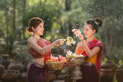 laos girls splashing water during festival Songkran festival by Pramote ...