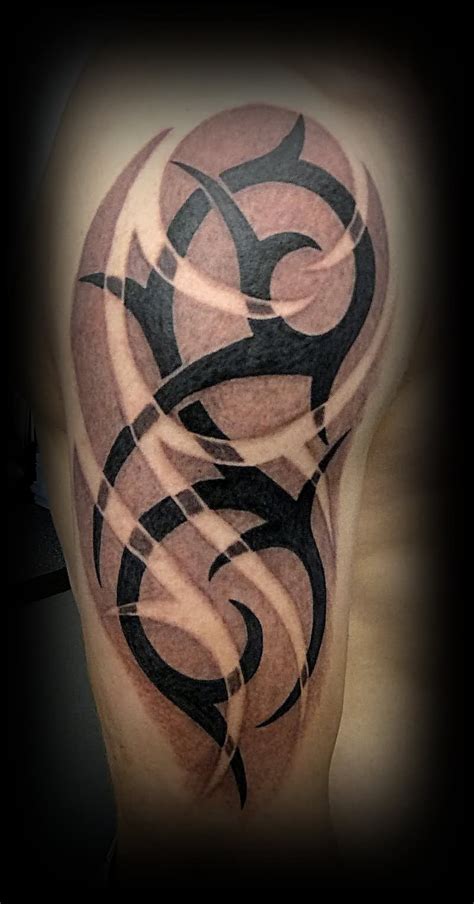 Tribal tattoos originate from ancient times and had deep meaning. 50 Tribal Tattoos For Men - InspirationSeek.com