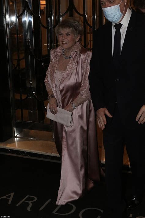 Elizabeth Hurley Attends Dame Joan Collins 88th Birthday Celebration