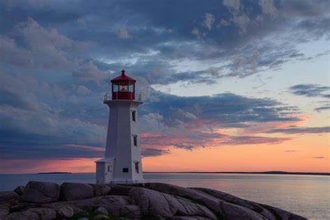 Peggys Cove Lighthouse Nova Scotia Reflections At Sunset