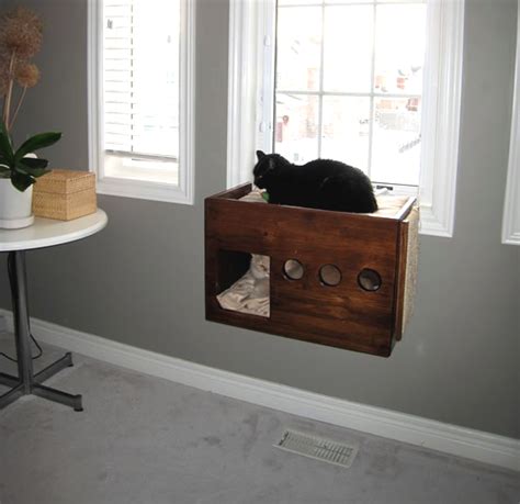 With a little bit of handiwork and creativity, you can give your pet a spot to rest or perch on. DIY Box Cat Perch - petdiys.com