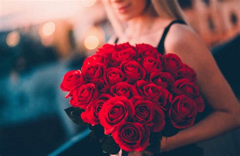 Woman Holding A Large Bouquet Of Red Roses Free Stock Photo Picjumbo