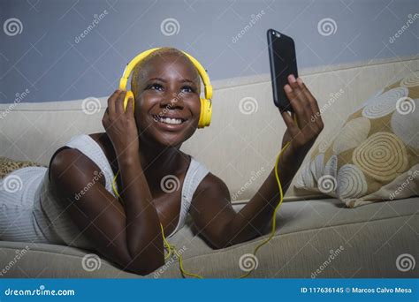 Young Happy And Beautiful Relaxed Black Afro American Woman Listening