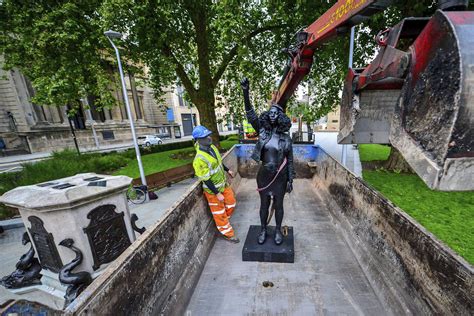 Black Uk Protester Statue Removed From Pedestal In Bristol