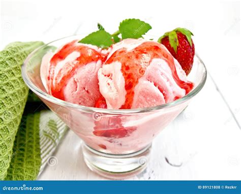 Ice Cream Strawberry With Syrup In Glass On Light Board Stock Photo