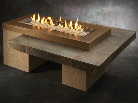 Style is served on patios and outdoor dining areas. Outdoor Greatroom Uptown Brown Fire Table with sanjani ...