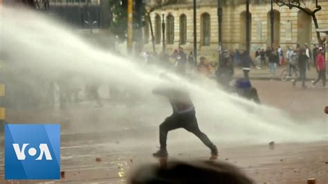 Colombian Police Use Water Cannons Tear Gas Against Protesters