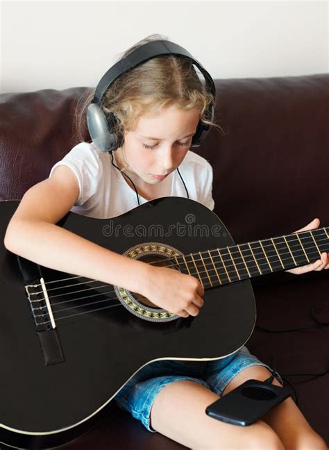 257 Little Girl Holding Acoustic Guitar Stock Photos Free And Royalty