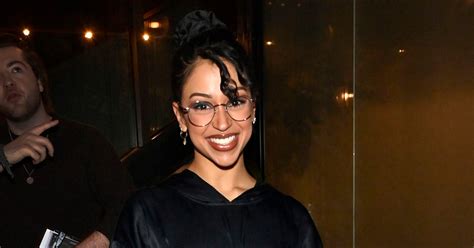 liza koshy is in her ‘spice girl era with funky up do itty bitty brown ring swimsuit sports