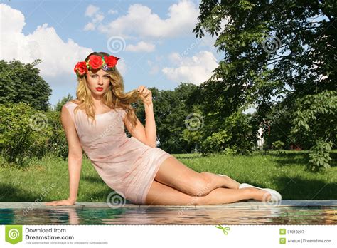 Female Model Posing By The Pool Royalty Free Stock