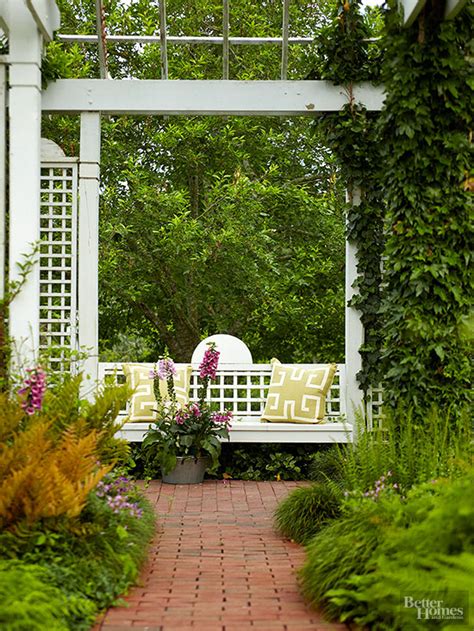 The elegant wood and metal details of this unique bench look good from all angles. Garden Bench Ideas