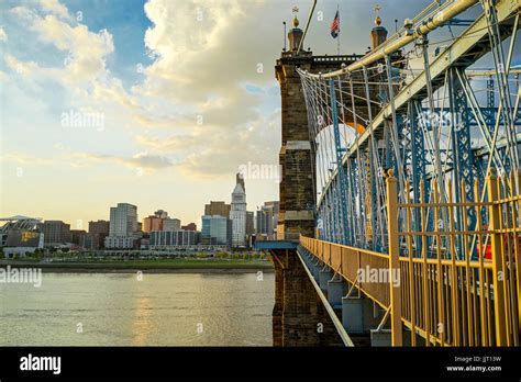 John A Roebling Suspension Bridge With Sunset And Clouds At Cincinnati