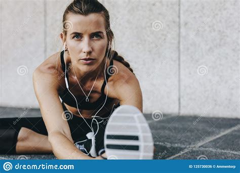 Woman Athlete Warming Up Doing Stretching Exercises Outdoors Stock Photo Image Of Health
