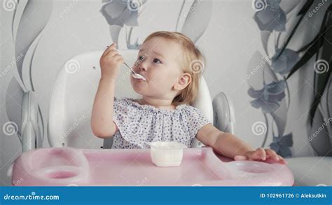 Girl Eating Yogurt On Kitchen Little Baby Kid Food Child Eating With