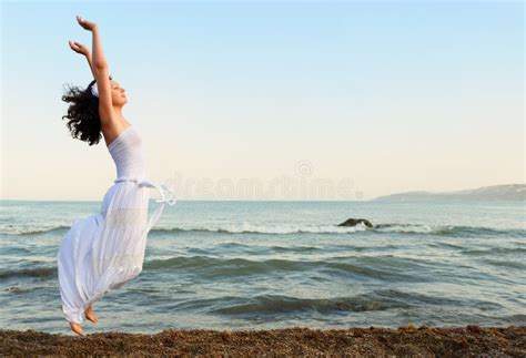 The Young Woman Jumps On Seacoast Stock Image Image Of Ocean