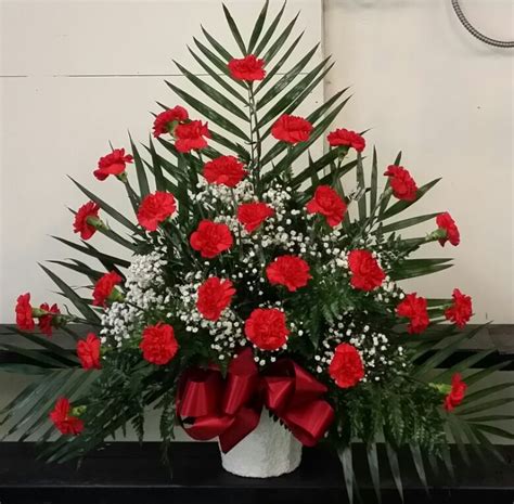 Red Carnation Arrangement With Greens And Baby Breath Flower