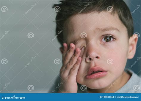Frustrated Toddler Boy Touching Face At Stock Photo Image Of Home