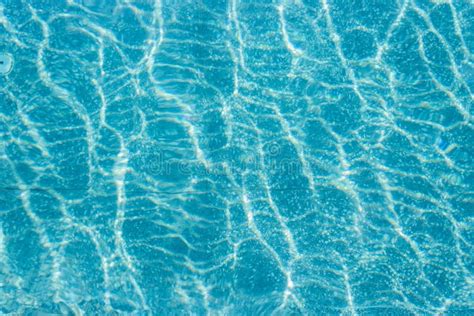 Abstract Top View Blue Ripple Swimming Pool Water And Sun Reflection Caustics Stock Image