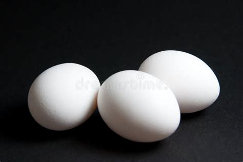 Three White Eggs On Black Background Stock Image Image Of Eggs Still