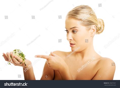 Healthy Nude Woman Pointing On Cuckooflower Stock Photo 235677241