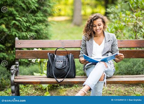 The Girl Sitting On A Bench Reading A Book Stock Image Image Of Life Book 131549413
